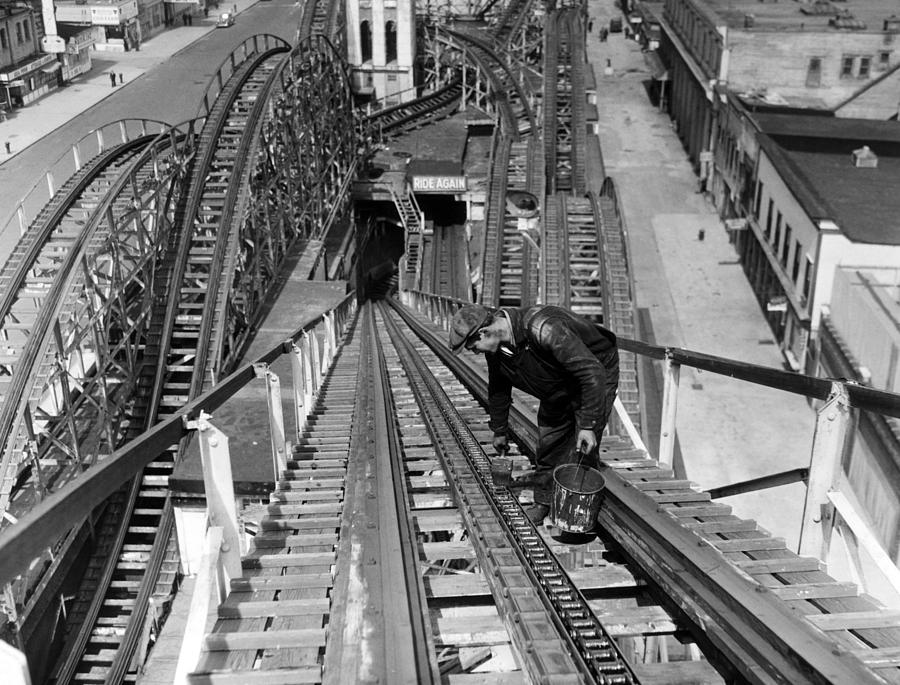 Grease Movie Photograph - A Workman Greases Up The Tracks by Everett