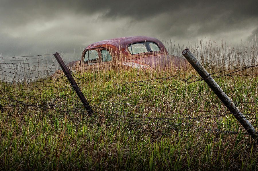 Abandoned Auto along a Wire Fence Photograph by Randall Nyhof