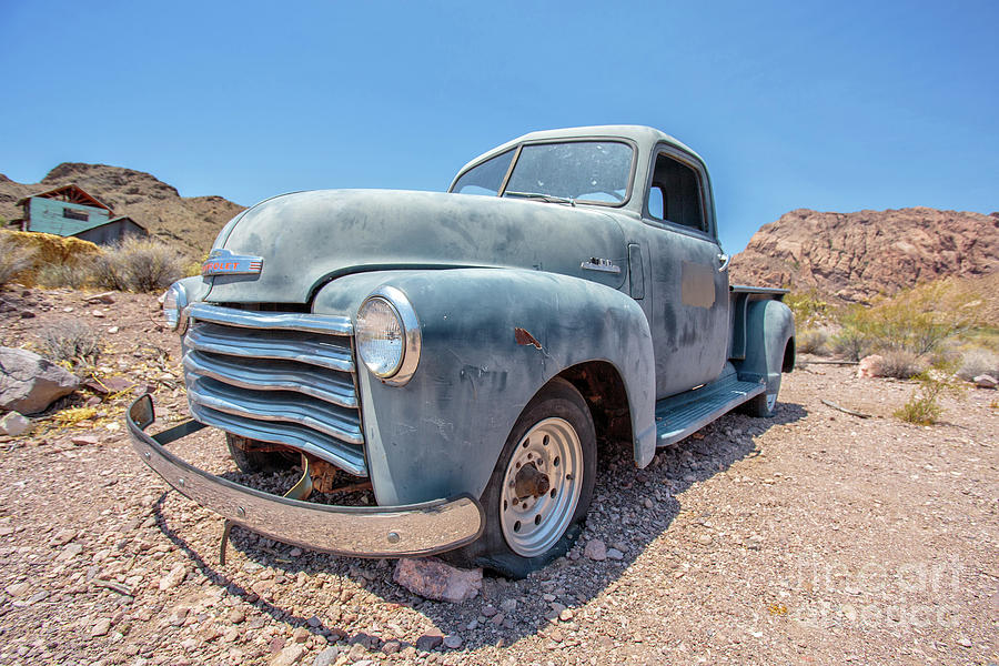 Vintage Photograph - Abandoned Blue Chevy Pickup Truck in the Desert by Edward Fielding