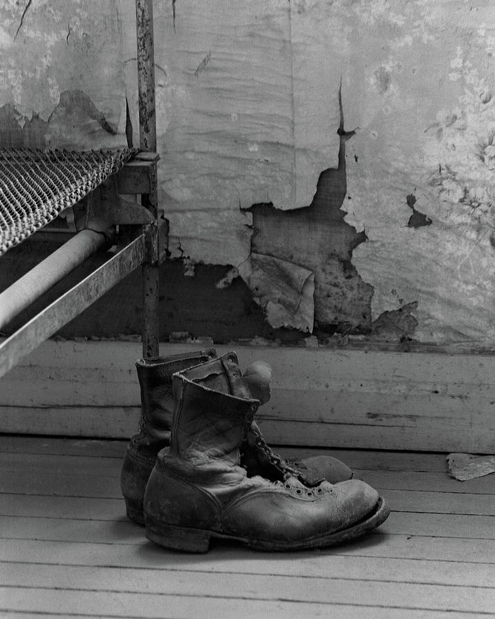 Abandoned boots Photograph by Dan McCool