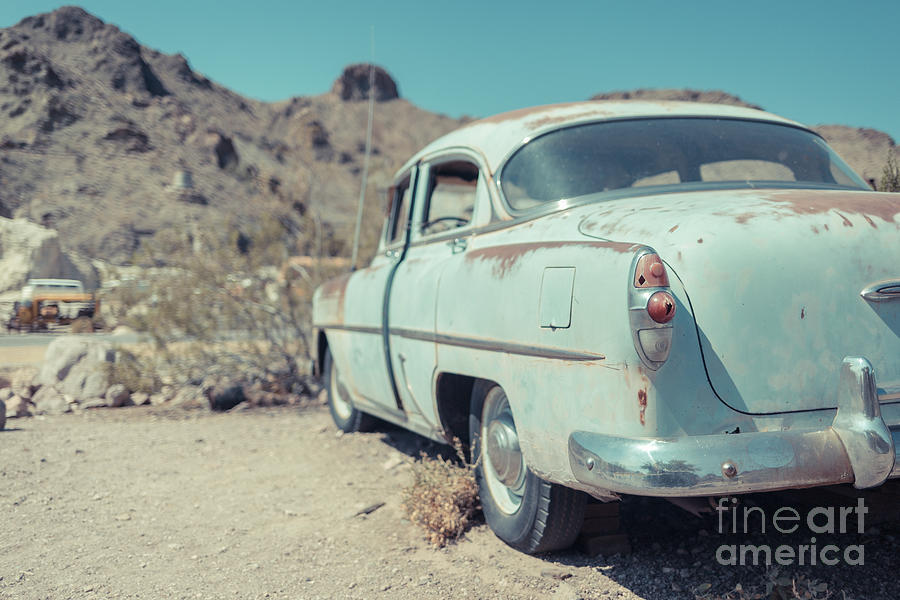 Abandoned old blue car in the Nevada Desert Photograph by Edward Fielding