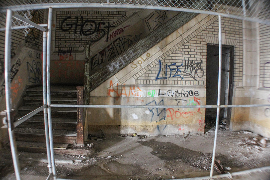 Abandoned Stairwell and cage Photograph by John McGraw