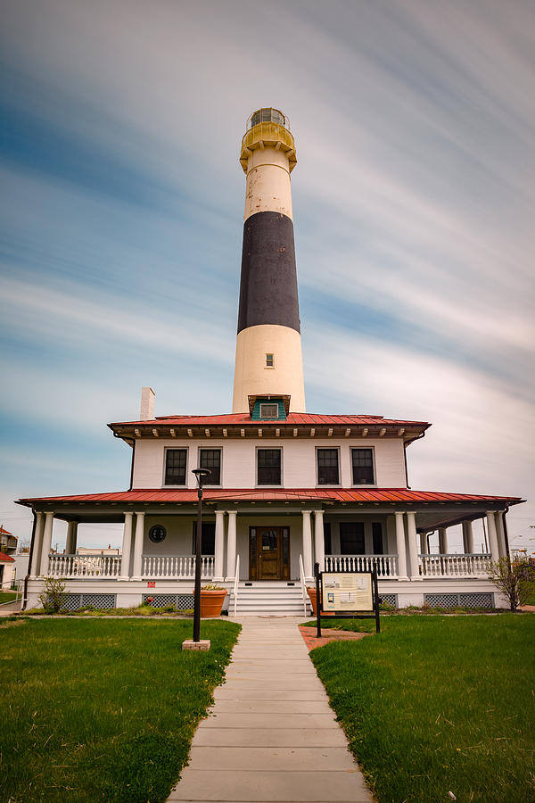 Absecon Lighthouse as the Clouds Pass By Photograph by Mark Rogers