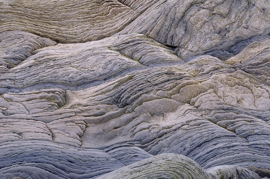 Abstract Photograph - Abstract pattern of wavy sedimentary layers of stone at the Bay  by Reimar Gaertner