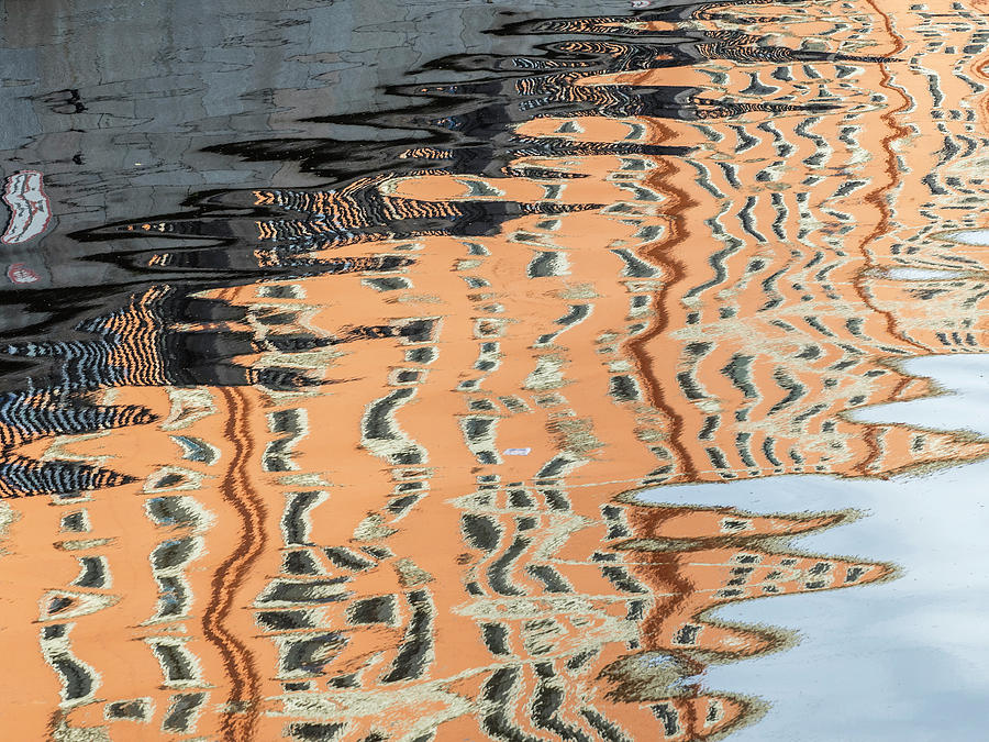 Reflection of buildings in water. Photograph by Usha Peddamatham