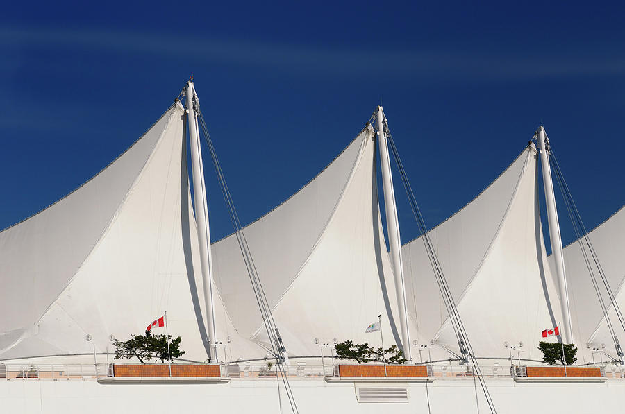 Abstract Photograph - Abstract white Canada Place sails in Vancouver against a blue sk by Reimar Gaertner