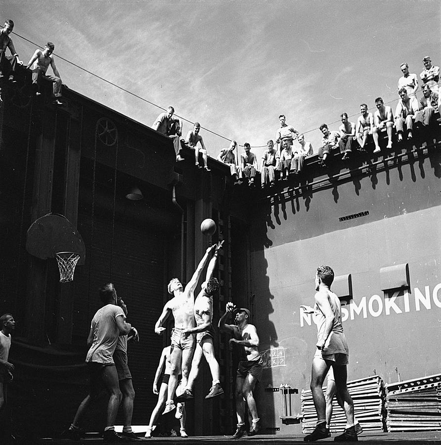 Activities aboard USS Monterey CVL-26. Navy pilots in the forward elevator well playing basketball Painting by Celestial Images