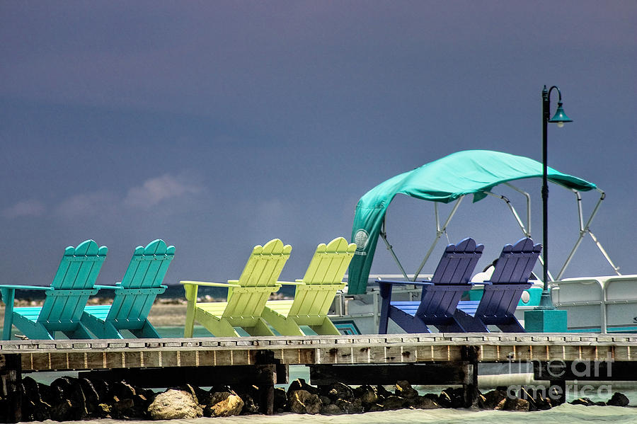 Nature Photograph - Adirondack chairs at Coyaba Mahoe Bay Jamaica. by John Edwards