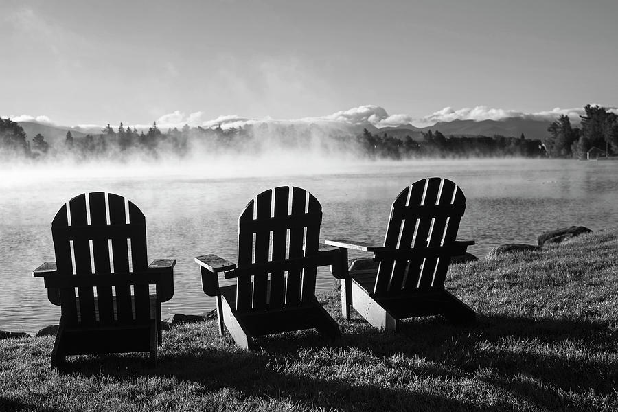 Adirondack chairs overlooking Mirror Lake in Lake Placid Black and White Photograph by Toby McGuire