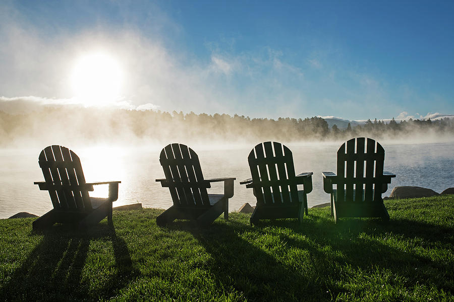 Adirondack chairs overlooking Mirror Lake in Lake Placid Sun Photograph by Toby McGuire