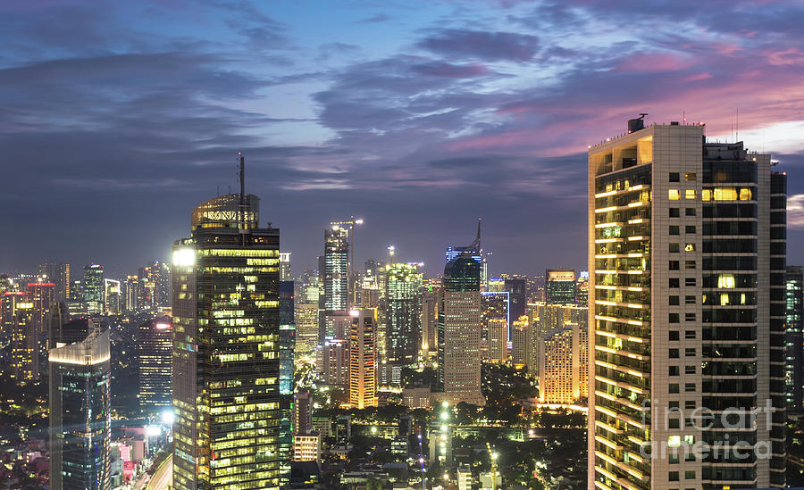 Aerial view of a stunning sunset over Jakarta business district  Photograph by Didier Marti