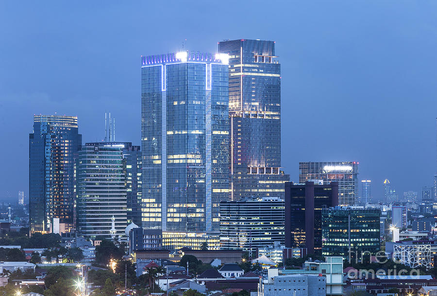 Aerial view of Jakarta business district at night in Indonesia.  Photograph by Didier Marti