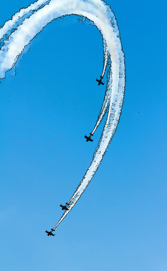 Aerobatic stunt airplanes in formation at airshow with white smoke ...