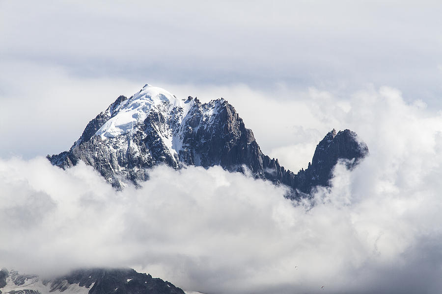 Aiguille Verte and Aiguille du Dru in the clouds - Chamonix - French Alps Photograph by Paul MAURICE