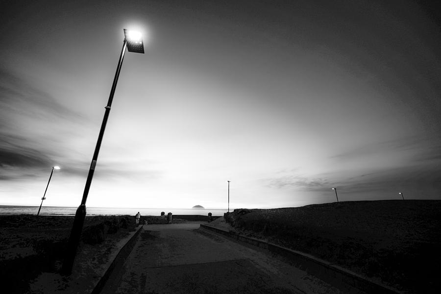 Landscape Photograph - Ailsa Craig and Promenade Lights at Dusk by Preston Reed
