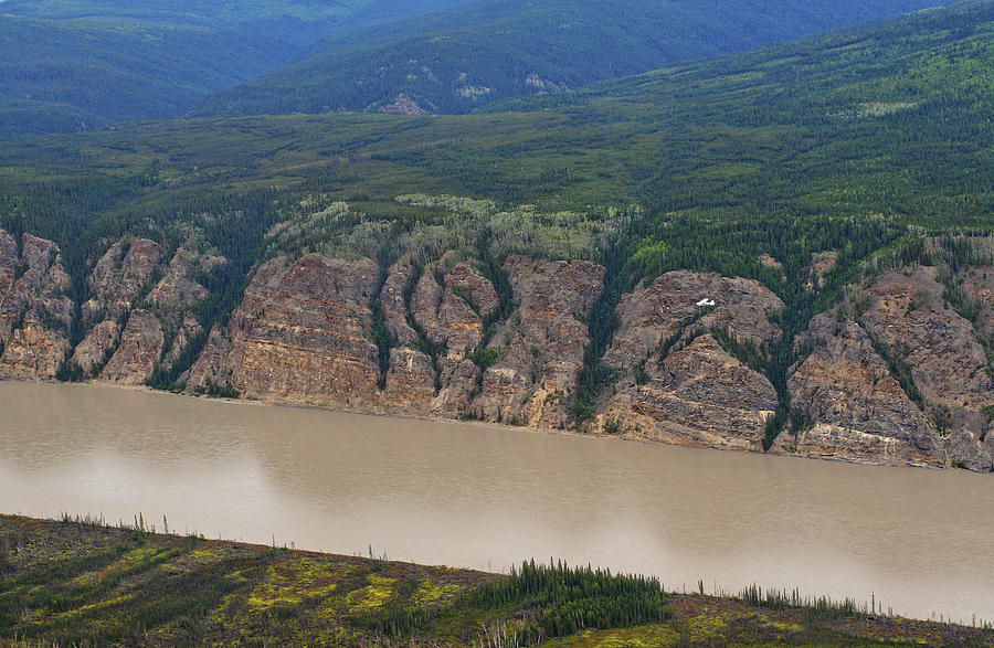 Airplane flying over the Yukon River Photograph by Waterdancer