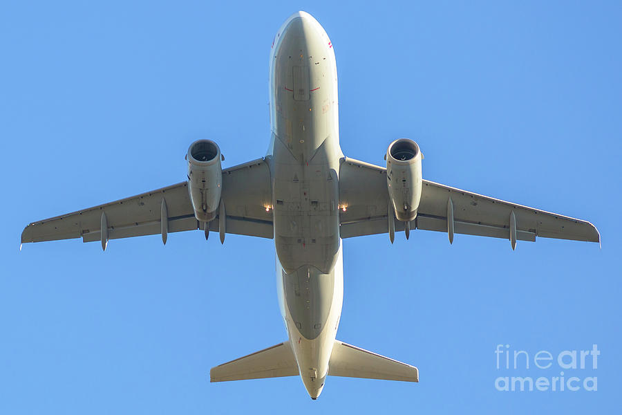 Airplane Isolated In The Sky Photograph by Benny Marty