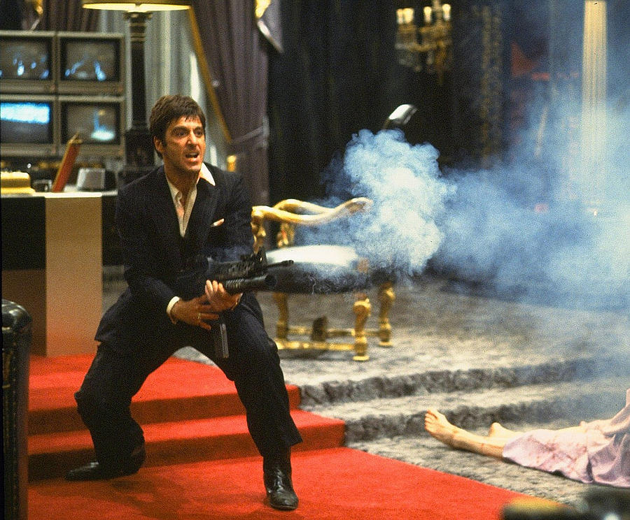 Al Pacino as Tony Montana with machine gun blasting his  fellow bad guys Scarface 1983 Photograph by David Lee Guss