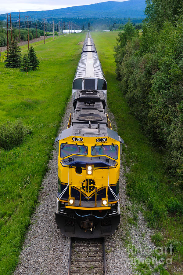 Alaska Railroad Train roles into Fairbanks on Summer Solstice Photograph by Gary Whitton