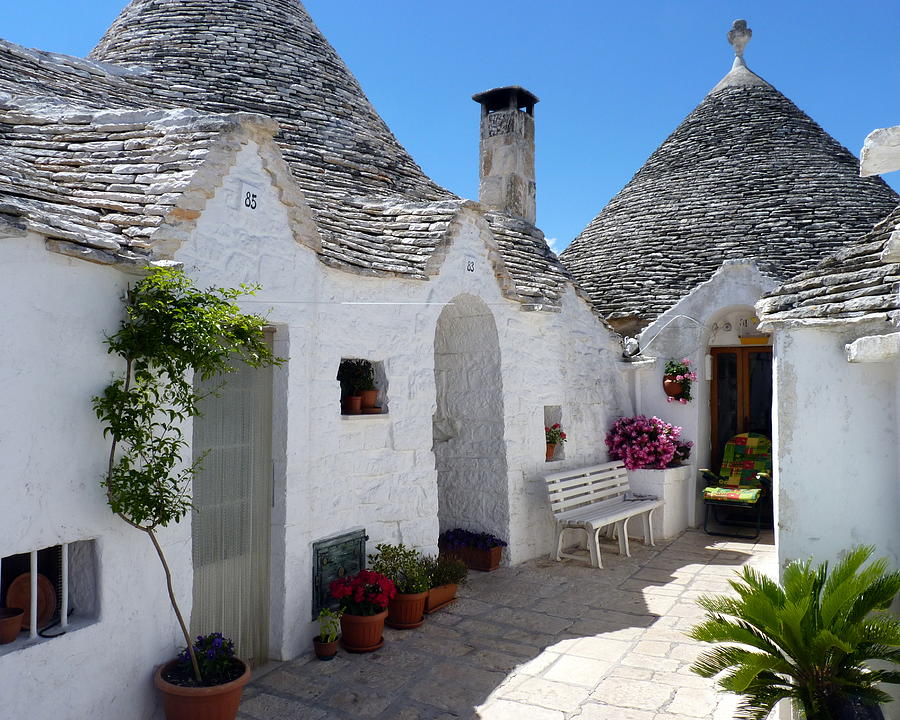 Alberobello Courtyard with Trulli Photograph by Carla Parris
