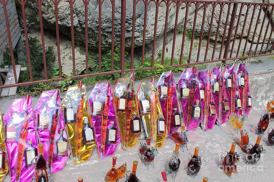 Alcohol In Beautiful Bottles For Sale To Tourists On The Street In The Chegem Gorge. Photograph