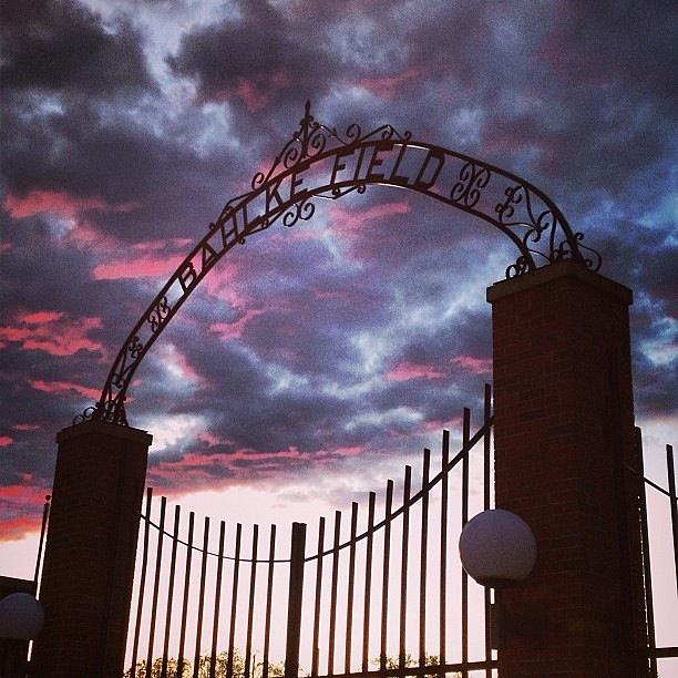 Alma College Bahlke Field Gates Clouds Photograph by Chris Brown