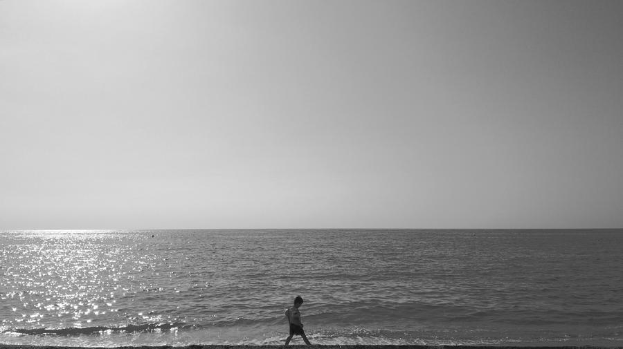 Alone on the beach Photograph by Alicia Guerrero - Pixels