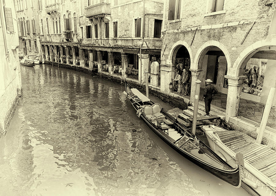 Along a busy canal in Venice Photograph by John Hoey