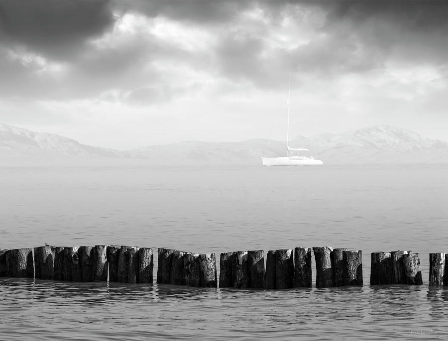 Black And White Photograph - Along The Breakwater by Wim Lanclus