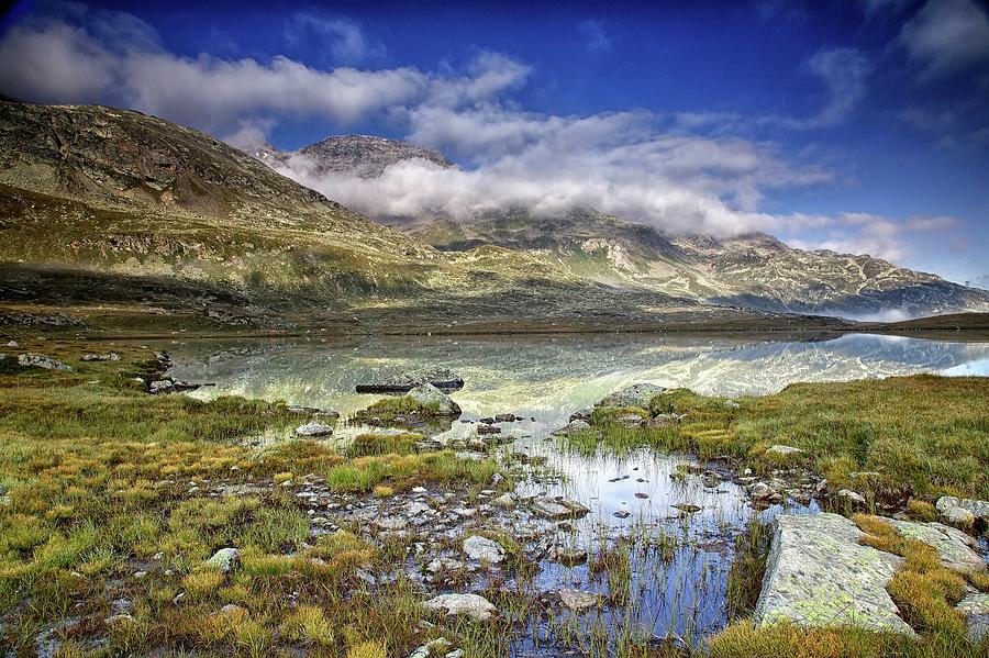 Alpine lake Photograph by Alberto Audisio
