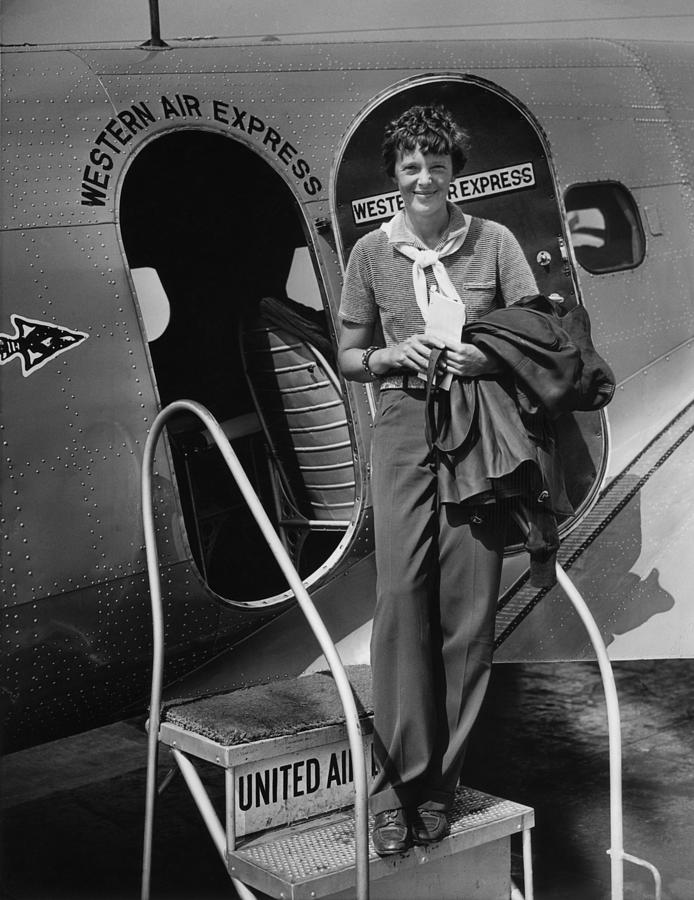Portrait Photograph - Amelia Earhart 1897-1937 Standing by Everett