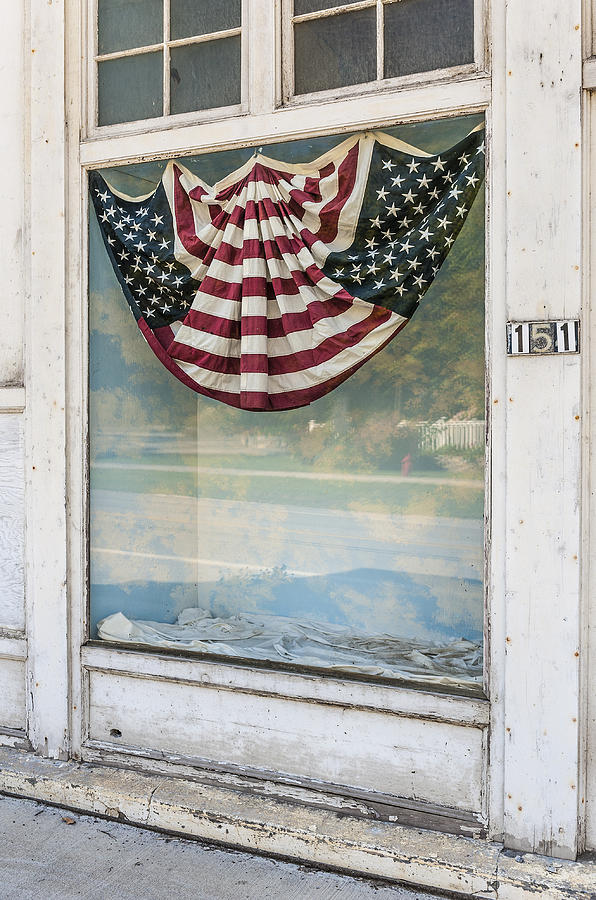 American flag  banner in a store front Photograph by Gary Warnimont