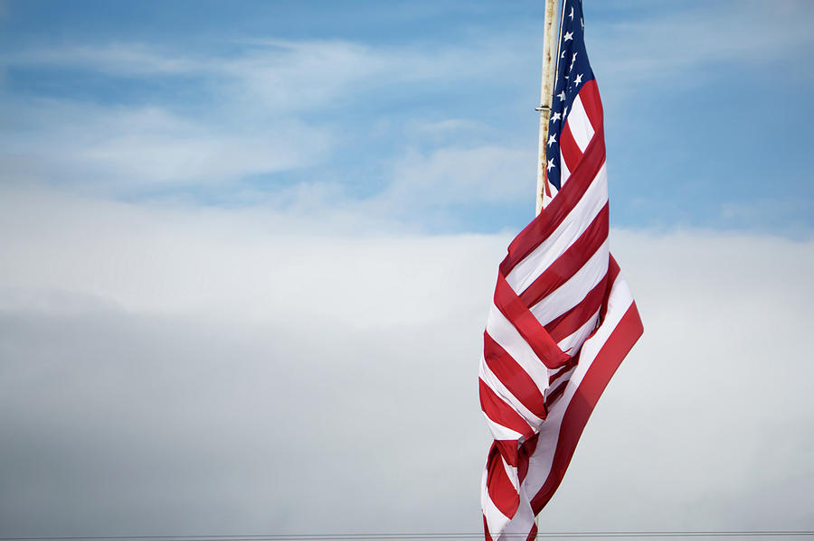 American Flag Flying On Blue Sky Background Photograph By Alex