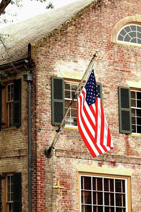 American flag in Colonial Williamsburg Photograph by Emanuel Tanjala