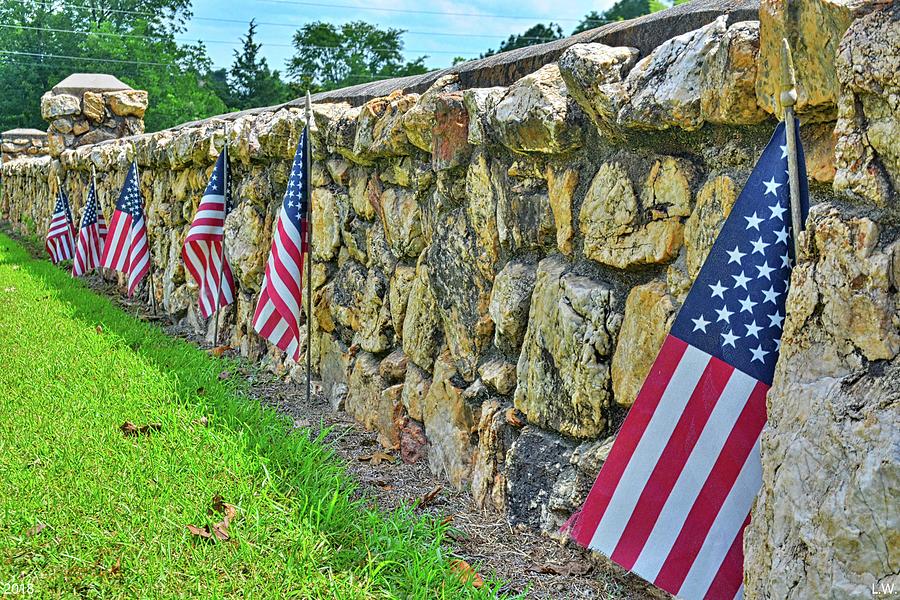 American Flags Along A Stone Cemetery Wall Photograph by Lisa Wooten