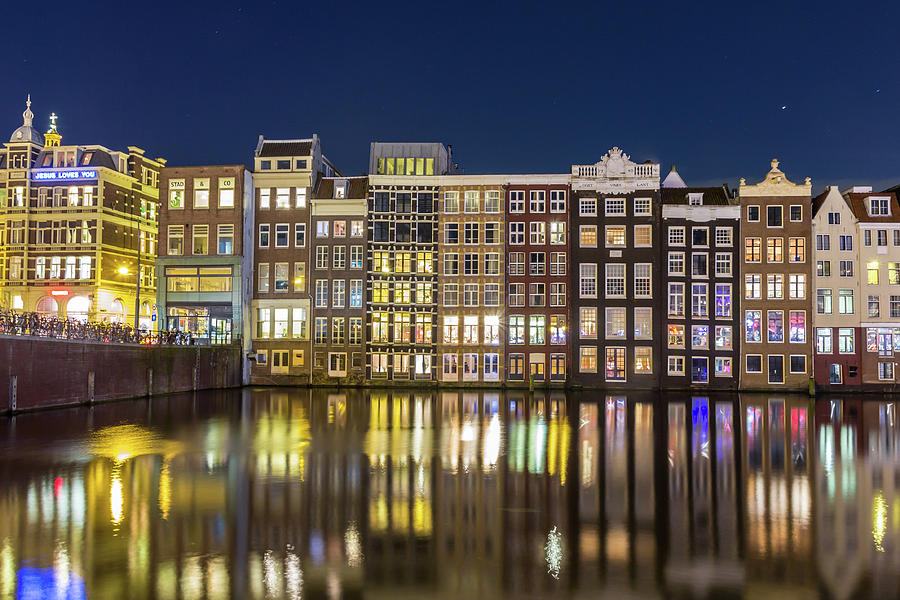 Architecture Photograph - Amsterdam canal houses at night by Andrew Balcombe