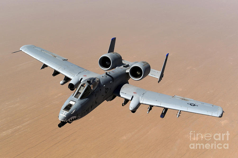 Transportation Photograph - An A-10 Thunderbolt II Over The Skies by Stocktrek Images