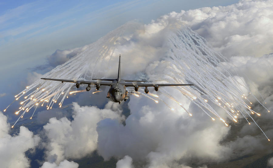 Airplane Photograph - An Ac-130u Gunship Jettisons Flares by Stocktrek Images