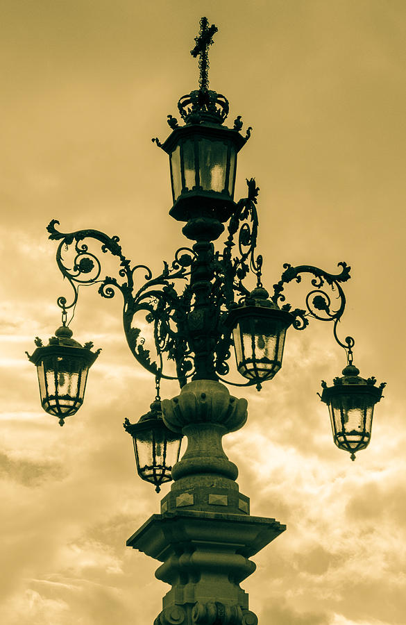 An Ancient Streetlight In Seville Photograph