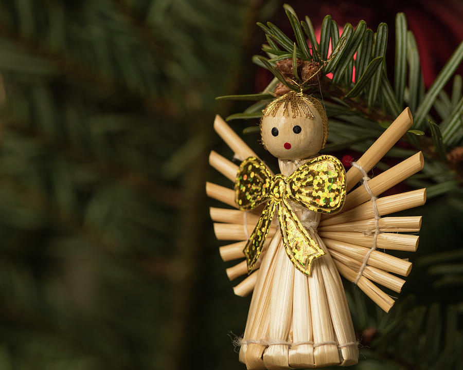 An angel made of straw hanging on a christmas tree Photograph by Stefan  Rotter - Pixels