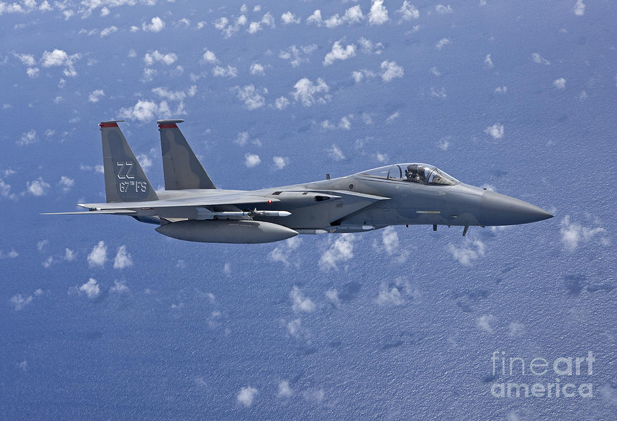 Transportation Photograph - An F-15 Eagle Flies Over The Pacific by HIGH-G Productions