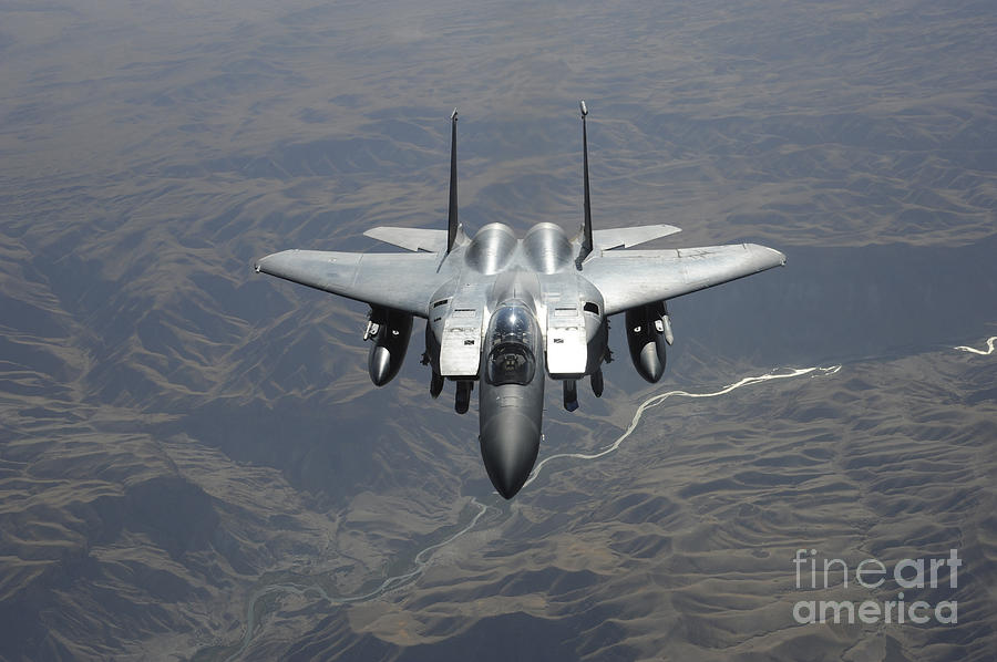 Transportation Photograph - An F-15e Strike Eagle Flies Watch by Stocktrek Images
