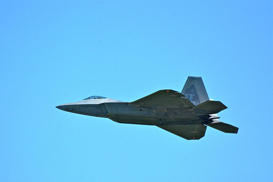 An F-22 Raptor Taking Off Photograph by Don Mercer