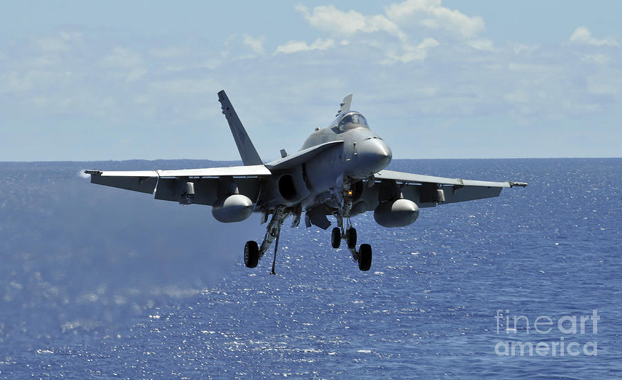 Airplane Photograph - An Fa-18c Hornet Approaches The Flight by Stocktrek Images