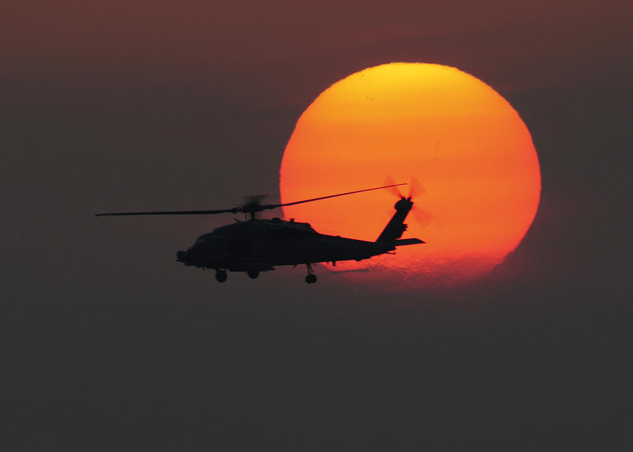 Chinfo Painting - An HH-60H Sea Hawk helicopter at sunset US Navy by Celest...