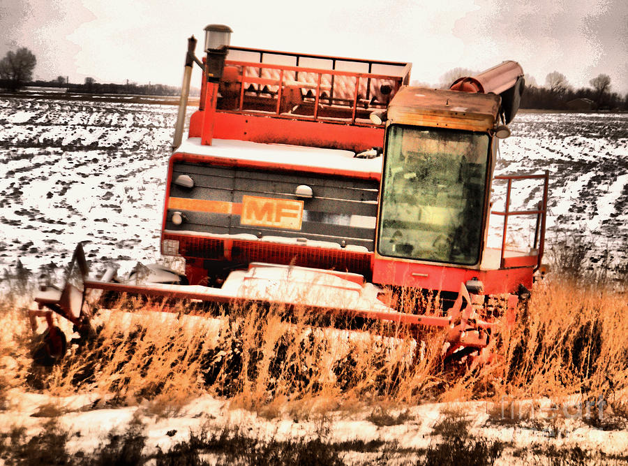An old harvestor Photograph by Jeff Swan