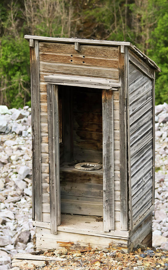 An Old Outhouse In A Rocky Mountain Ghost Town Photograph