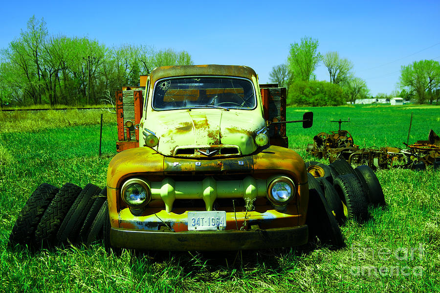 An old rusting Ford Photograph by Jeff Swan