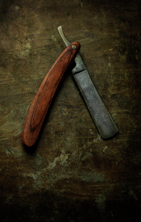 An old rusty razor Photograph by Jaroslaw Blaminsky