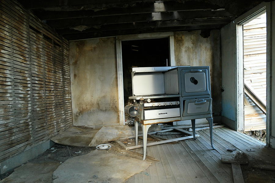 An old stove left behind Photograph by Jeff Swan